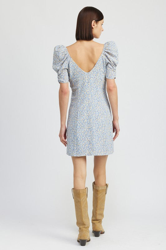 Emory Park Floral Mini Dress With Puff Sleeves in light blue with a low back worn with tan boots