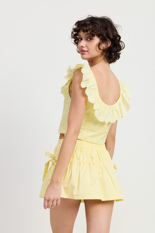 Emory Park Square Neck Ruffle Corset Top in soft yellow with eyelet ruffle details and sleeveless design