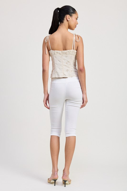 Emory Park Bustier Top With Shoulder Ties in beige worn by model with white pants and heels