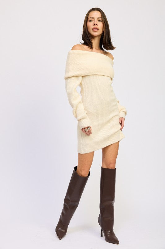 Emory Park model wearing Long Sleeve Off-Shoulder Mini Knit Dress in cream with long sleeves and brown knee high boots