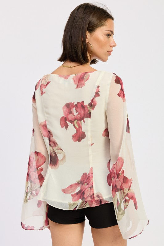 Back view of Emory Park Tie Front Long Sleeve Floral Blouse with bell sleeves and vibrant floral print