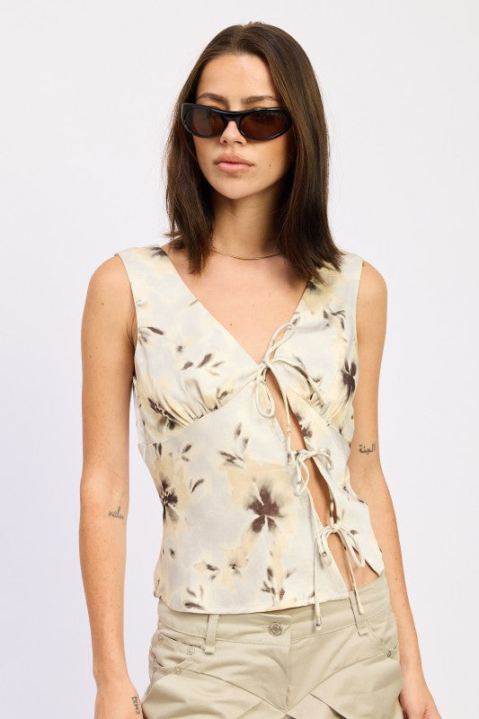 Emory Park cream floral sleeveless tie front top with side ribbon ties worn by model with sunglasses