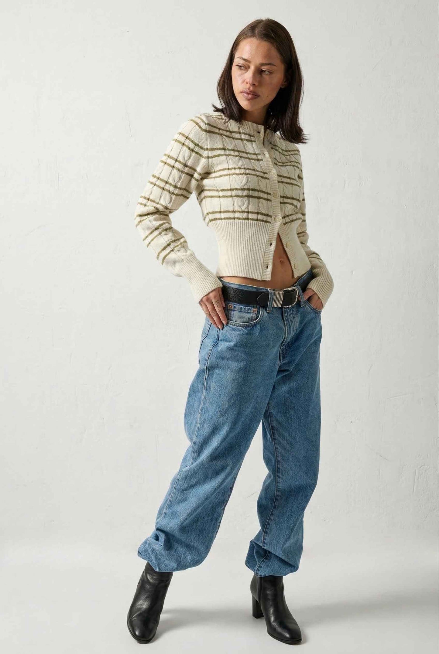 Model wearing Margot Top Striped Crew Neck Button-Up Cardigan in Cream with jeans and heeled boots