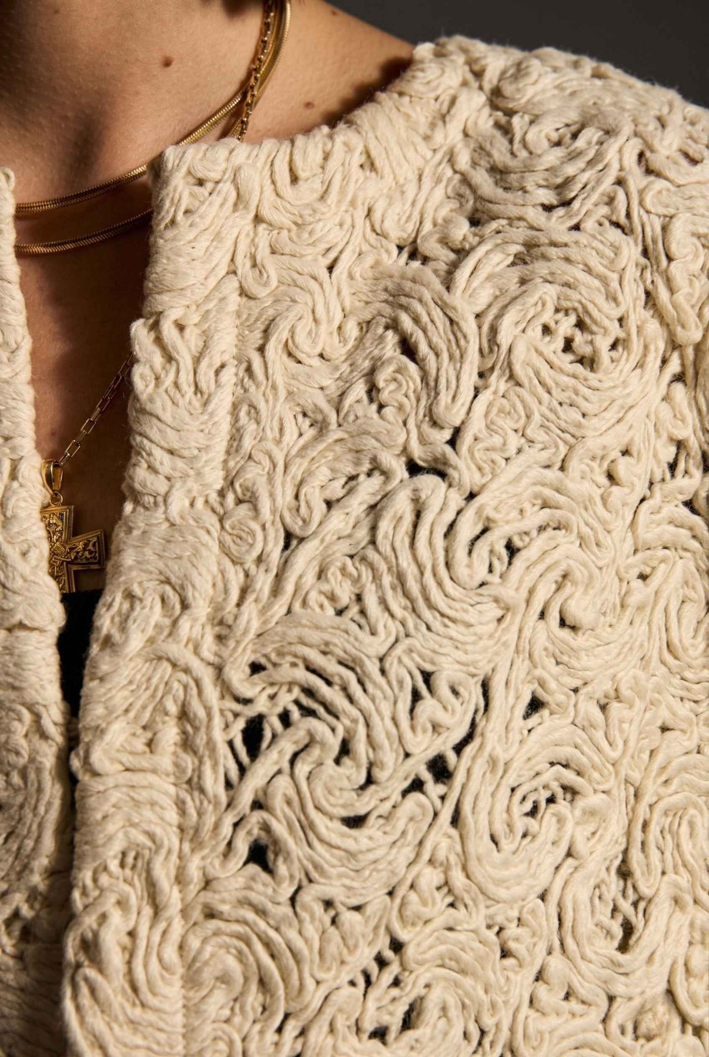 Model wearing Serenity Jacket in Cream Macramé Lace Open-Front Cropped Cardigan over tank top