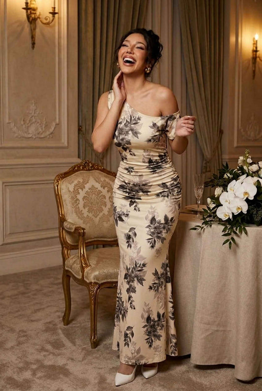 Woman wearing The Arabella One-Shoulder Dress Ruched Floral Ivory Long Dress with heels laughing at elegant evening occasion