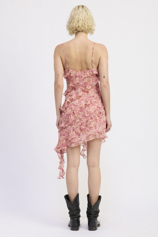 Emory Park back view of model wearing pink floral Asymmetrical Ruffle Mini Dress with spaghetti straps and black boots