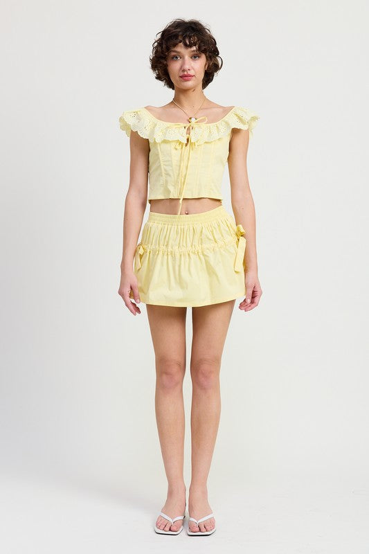 Emory Park yellow Mini Ruched Poplin Mini Skirt styled with matching ruffled crop top and white sandals