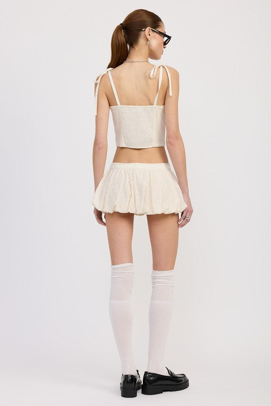 Emory Park Bubble Mini Skirt With Elastic Waistband in cream worn with a matching crop top and knee-high socks
