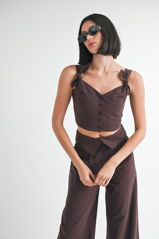 Emory Park Button Up Cropped Top With Shoulder Ties in dark brown worn with matching pants