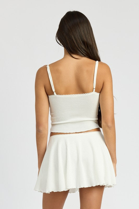 Back view of woman wearing Emory Park Cinch Front Cami Top in white with adjustable straps