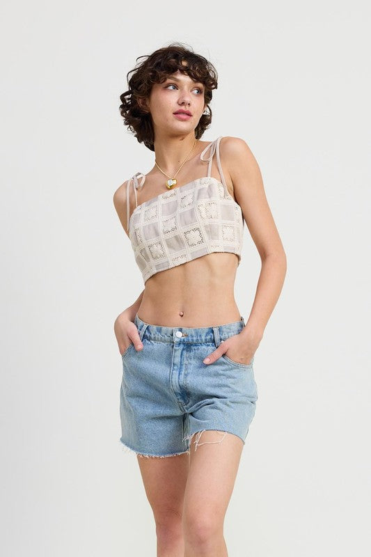Emory Park cropped crochet top in beige with square pattern and tie straps worn with denim shorts
