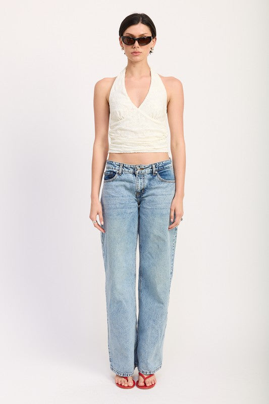 Emory Park Cropped Halter Top With Lace Detail in white worn with blue jeans and sunglasses