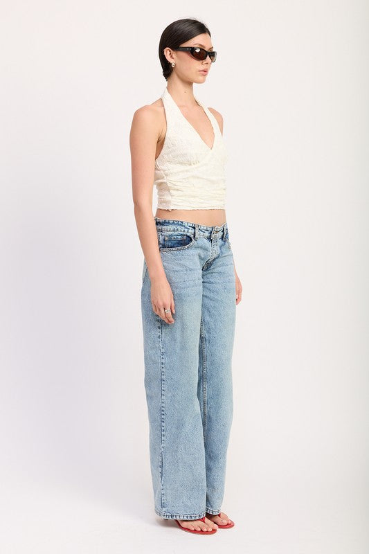 Emory Park white Cropped Halter Top With Lace Detail paired with light blue wide-leg jeans and red sandals