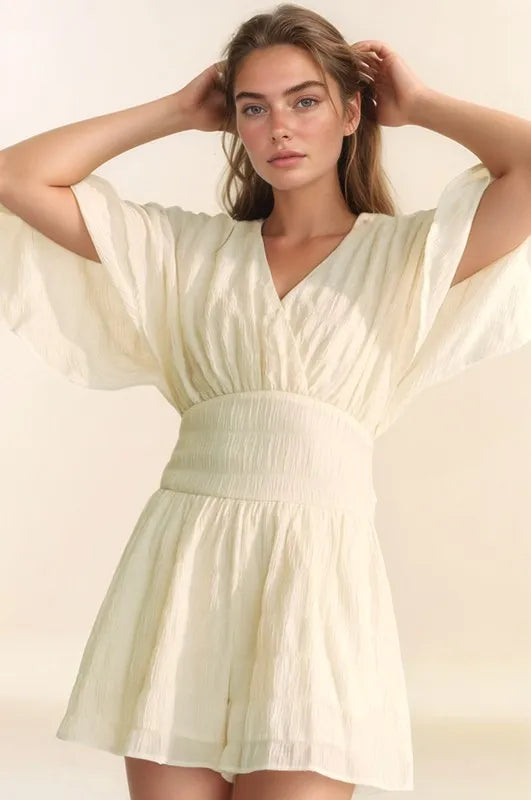 Davi & Dani Batwing Sleeve Waist Belt Romper in Cream with Flowy Fabric and V-Neckline