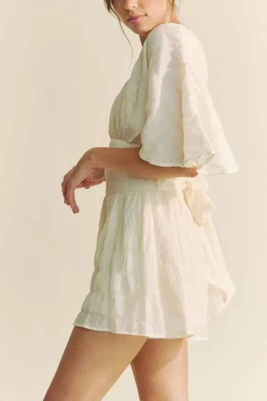 Davi & Dani Batwing Sleeve Waist Belt Romper in Cream with Elegant Silhouette and Flowy Design
