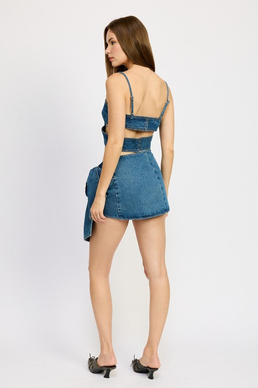 Emory Park Denim Bow Detail Mini Skirt in blue worn by model with matching top and heels