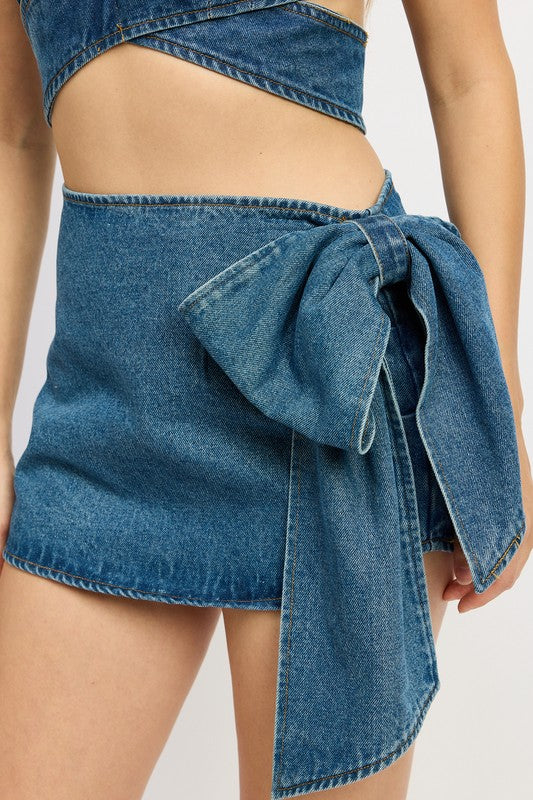 Emory Park Denim Bow Detail Mini Skirt in blue denim with large bow accent on the side