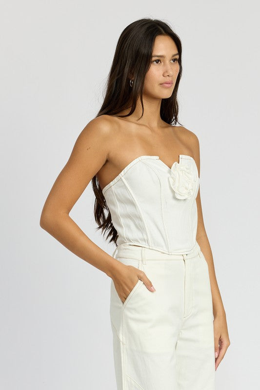 Emory Park white denim corset top with rosette detail worn by model with long dark hair