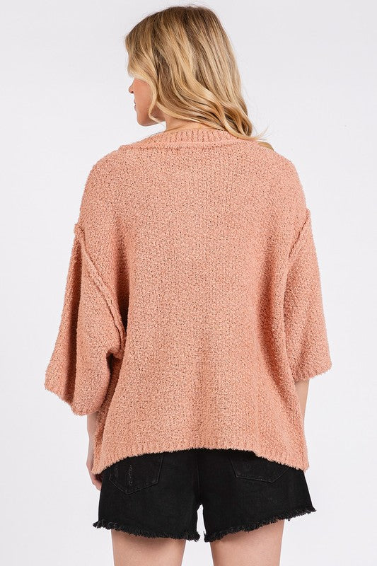 Drop Shoulder Side Slit Sweater in soft peach color with relaxed fit and cozy texture