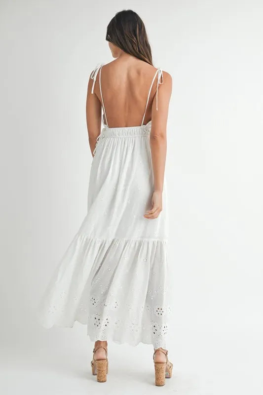 Back view of a stylish Eyelet Lace Maxi Dress with tie straps and a flowing design