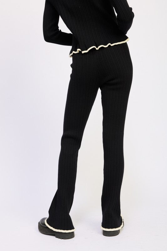 Emory Park Flared Knit Pant With Lettuce Hem black ribbed back view paired with matching top and cream trim