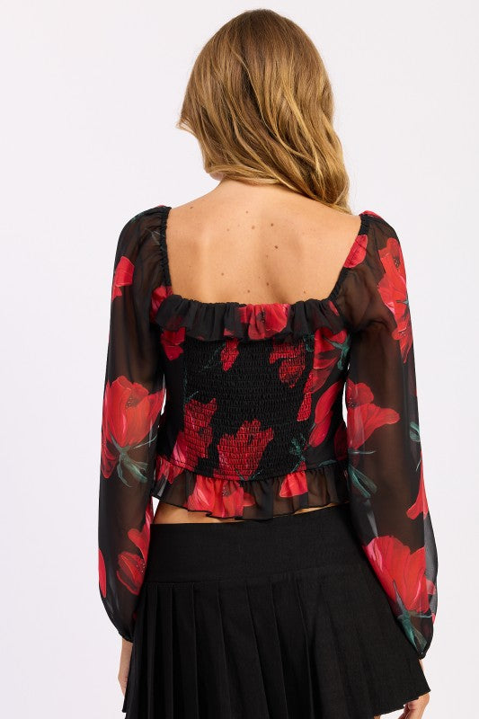 Emory Park Floral Long Sleeve Ruffled Top with Black Background and Red Flower Design