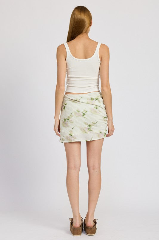 Emory Park floral pencil skirt with side slit worn by model in white tank top and sandals