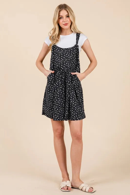 Floral Print Overalls in black with white floral details and pockets, ideal for casual summer outfits