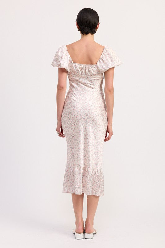 Back view of Floral Puff Sleeve Midi Dress by Emory Park in light floral pattern with ruffle hem