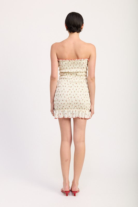 Emory Park Floral Smocked Tube Dress in cream with small floral print and ruffle hem shown from back