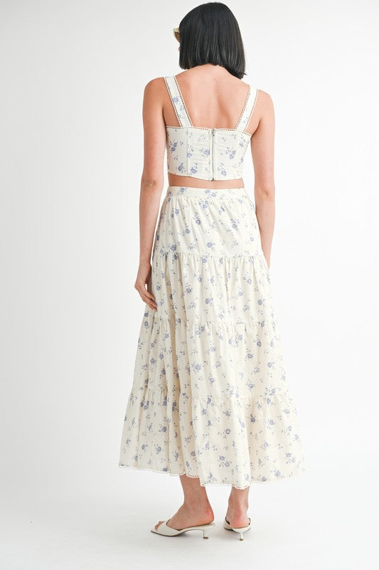 Back view of woman wearing Emory Park Floral Squared Neck Top with matching floral skirt and white heels