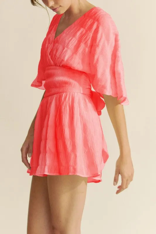 Flutter Sleeve Romper in Vibrant Pink with a Flattering Wrap Design
