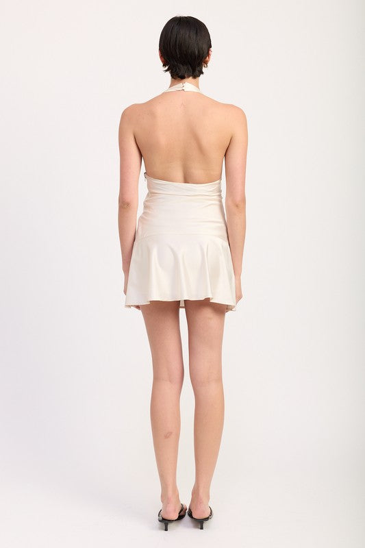 Back view of model wearing Emory Park Halter Mini Dress With Lace Trim in ivory open back ruffle hem