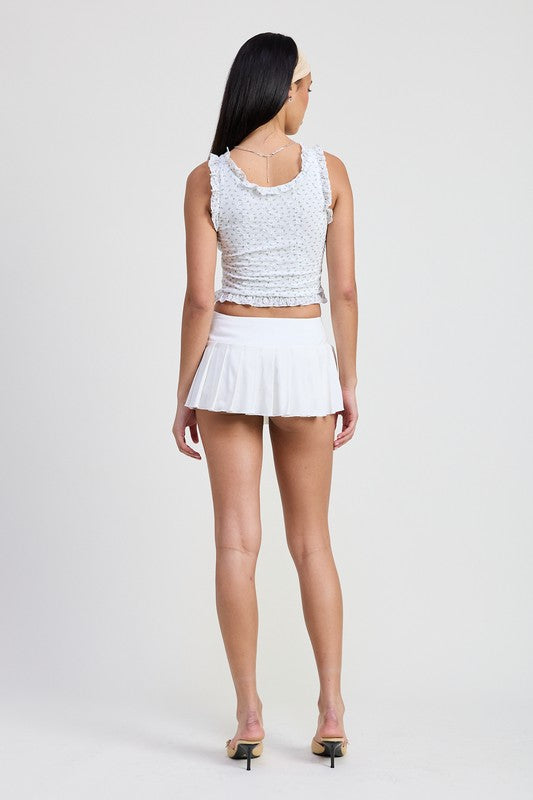 Back view of woman wearing Emory Park Lace Ruffle Edge Top in white with matching white skirt