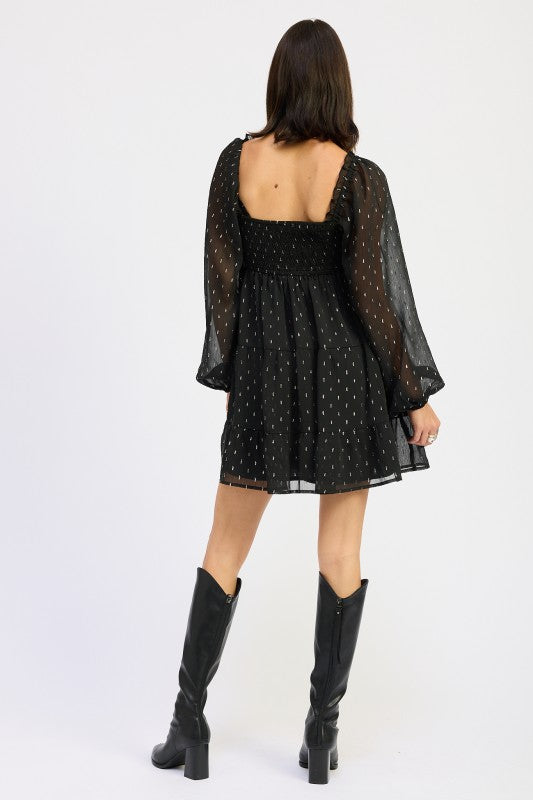 Back view of Long Sleeve Smocked Baby Doll Mini Dress by Emory Park with sheer puff sleeves