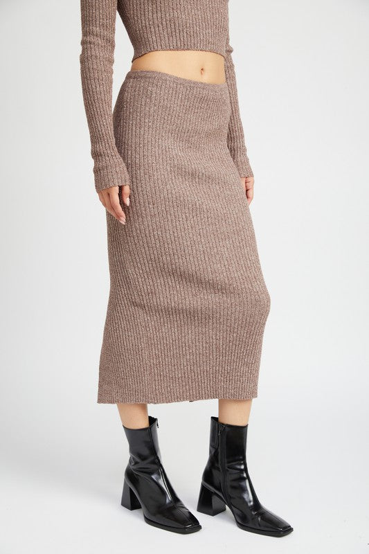 Emory Park Maxi Knit Skirt With Back Slit in brown ribbed knit worn with matching top and black ankle boots