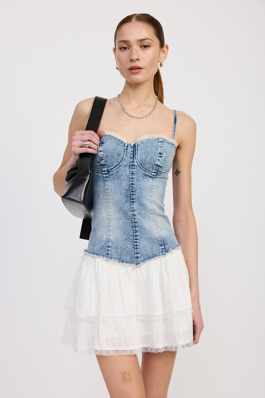 Emory Park Mini Corset Denim Dress with fitted bodice and white tiered skirt worn by model