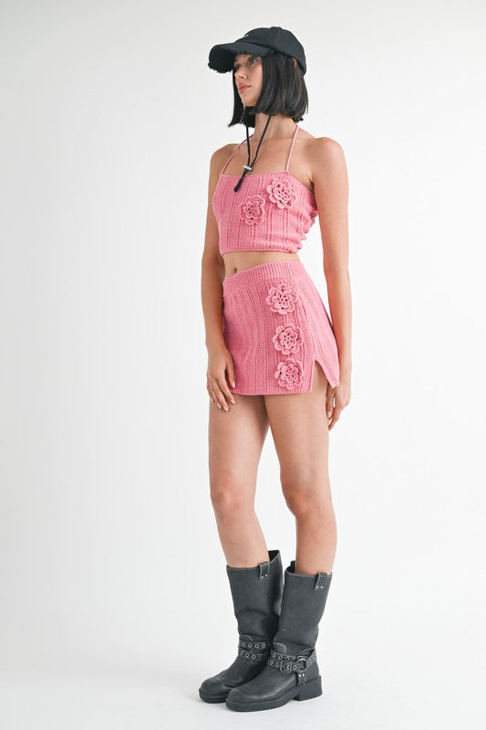 Emory Park pink mini crochet skirt with floral details styled with matching crop top and black boots