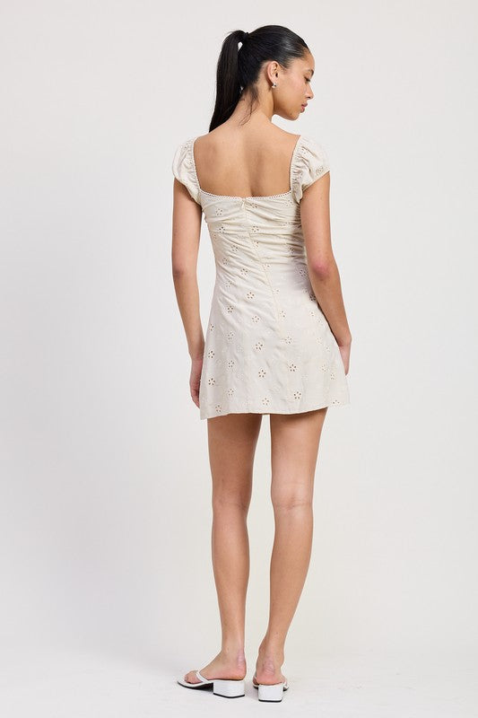 Emory Park Mixed Media Mini Ruched Dress in cream with short sleeves and floral details