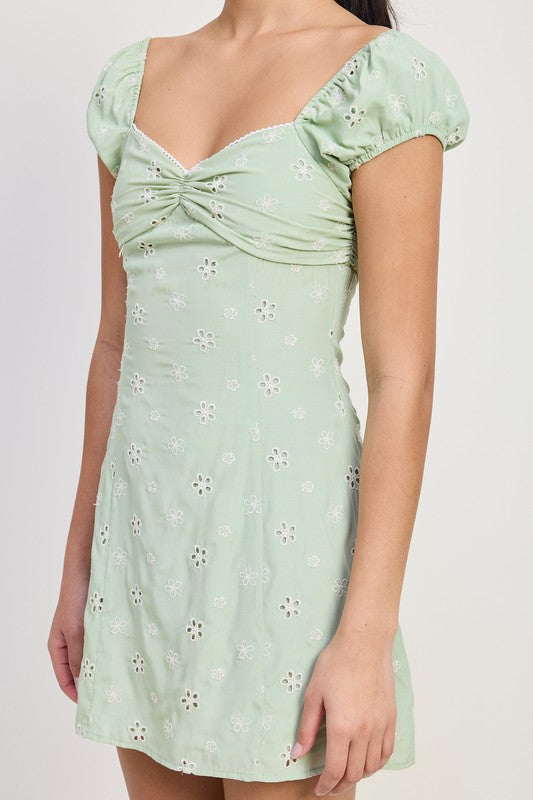 Emory Park Mixed Media Mini Ruched Dress in light green with floral eyelet pattern and puff sleeves