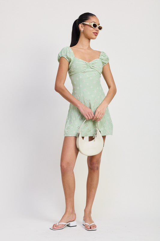 Emory Park Mixed Media Mini Ruched Dress in light green with puff sleeves and floral pattern
