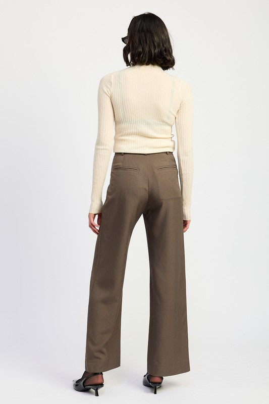 Emory Park model wearing brown wide leg Trouser Pants With Adjustable Waist Buckle back view with cream ribbed top and black heels