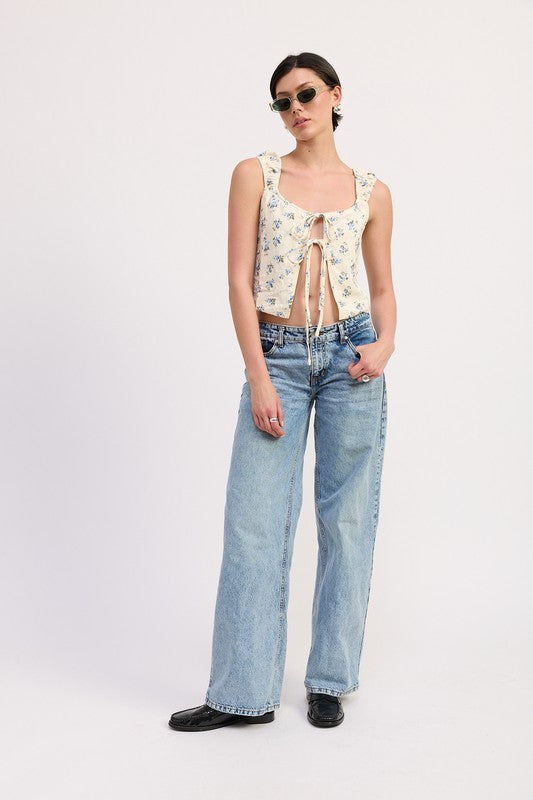 Emory Park Tie Front Peasant Top with floral print paired with high-waisted wide-leg jeans and sunglasses