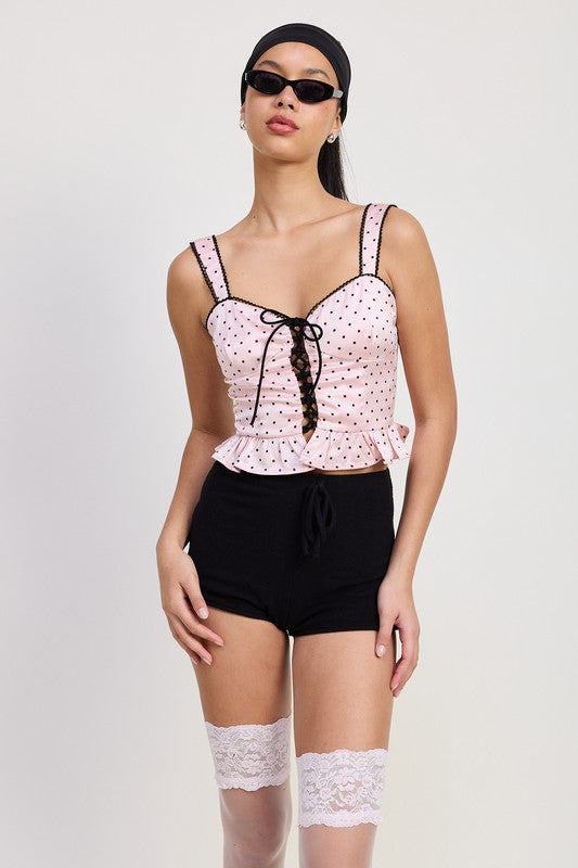 Emory Park Polka Dot Corset Top in light pink with black dots and lace-up front detail