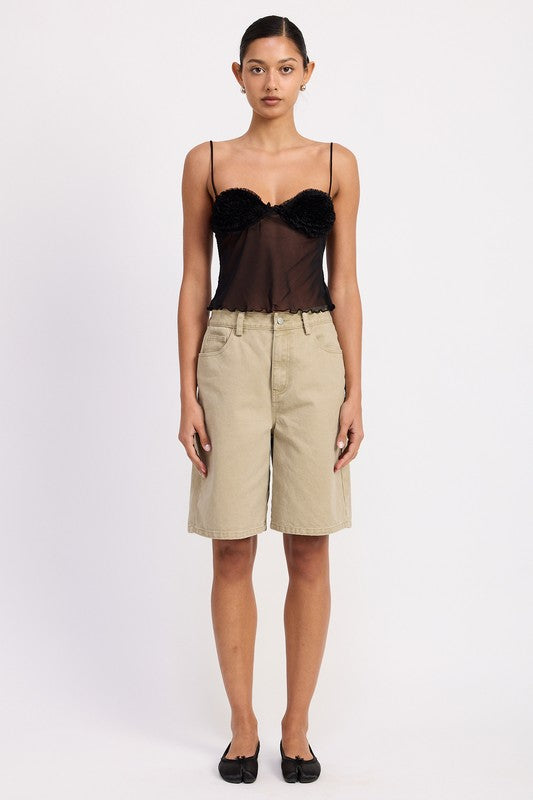 Model wearing Emory Park Sheer Mesh Floral Cup Cami Top in black with khaki bermuda shorts and black flats