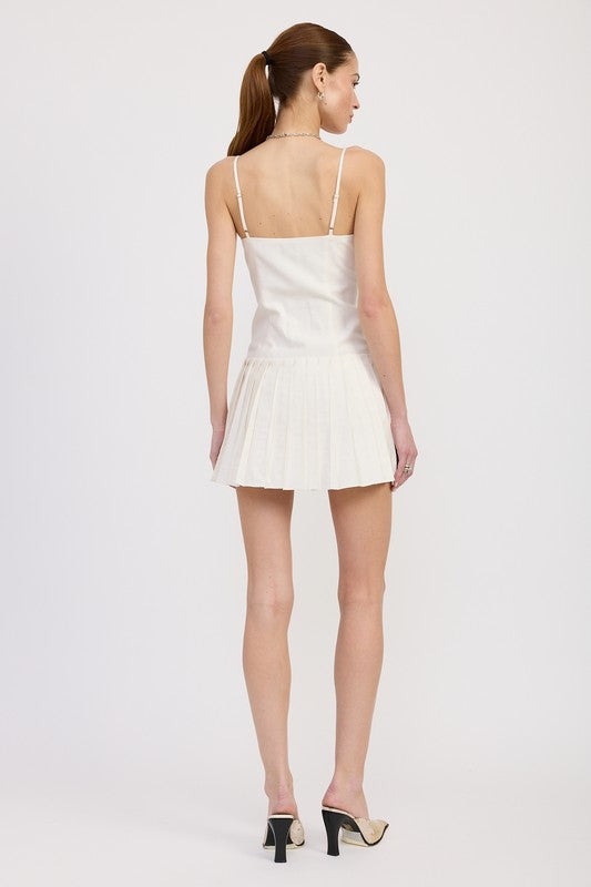 Emory Park Spaghetti Strap Pleated Mini Dress in white worn by model showing back view with high heels