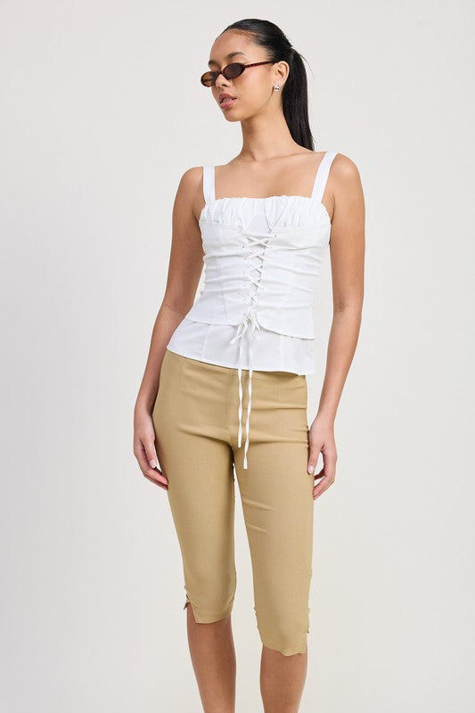 Emory Park white Square Neck Corset Top with ruched front and straps worn with beige cropped pants