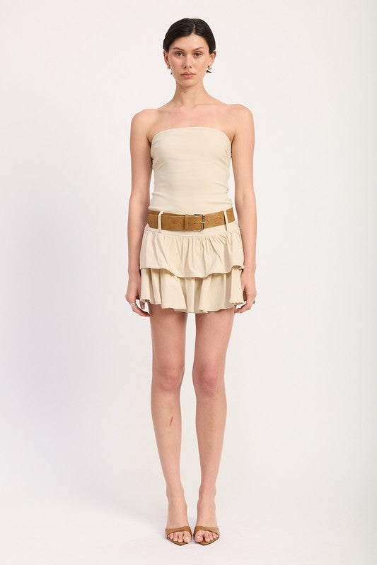 Emory Park Strapless Tiered Mini Dress With Belt in beige modeled on a standing woman