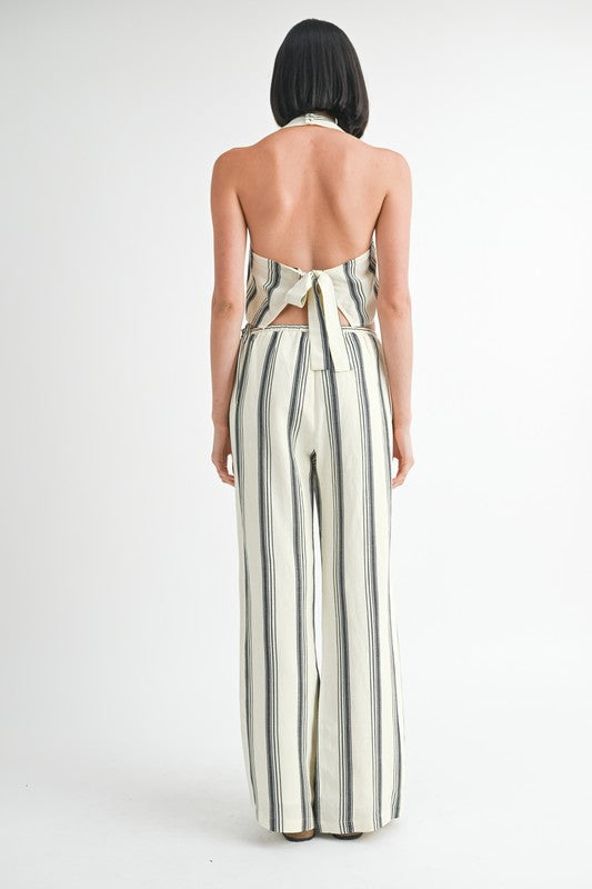 Emory Park striped straight leg pants in white with black vertical stripes modeled from the back