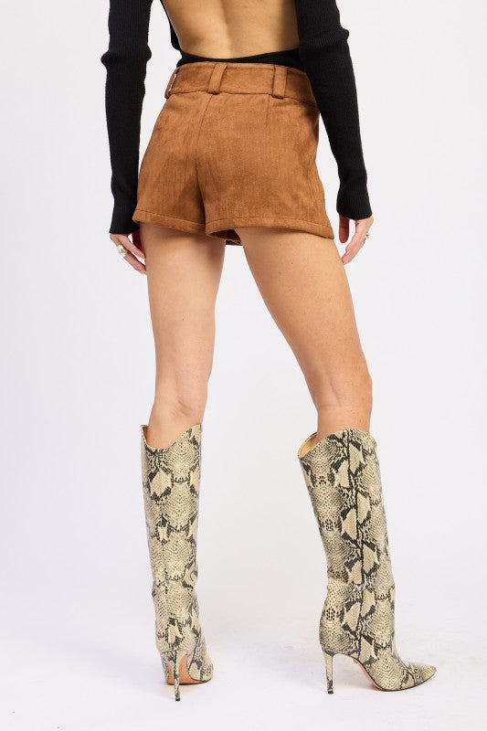 Emory Park Suede Low-Rise Shorts in Brown with a stylish back view paired with snake-print boots